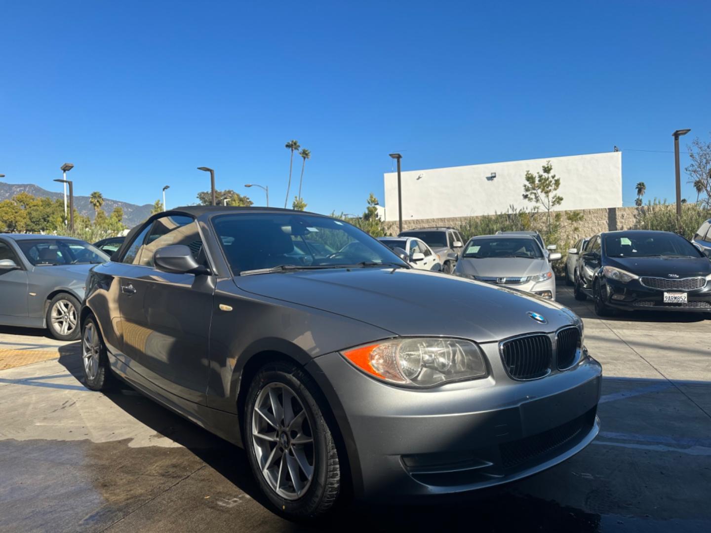 2011 Gray /Black BMW 1-Series 128i Convertible (WBAUN1C52BV) with an 3.0L L6 DOHC 24V engine, Automatic transmission, located at 30 S. Berkeley Avenue, Pasadena, CA, 91107, (626) 248-7567, 34.145447, -118.109398 - Low Miles!!! Elevate your driving experience with our 2011 BMW 1-Series 128i Convertible, now featured at our Buy Here Pay Here (BHPH) dealership in Pasadena, CA. Ideal for enthusiasts in Altadena CA, Glendale CA, Los Angeles CA, and throughout LA County, this stunning pre-owned convertible combine - Photo#6